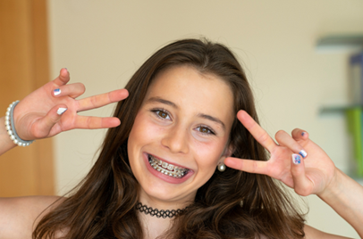 Teens with braces smiling together