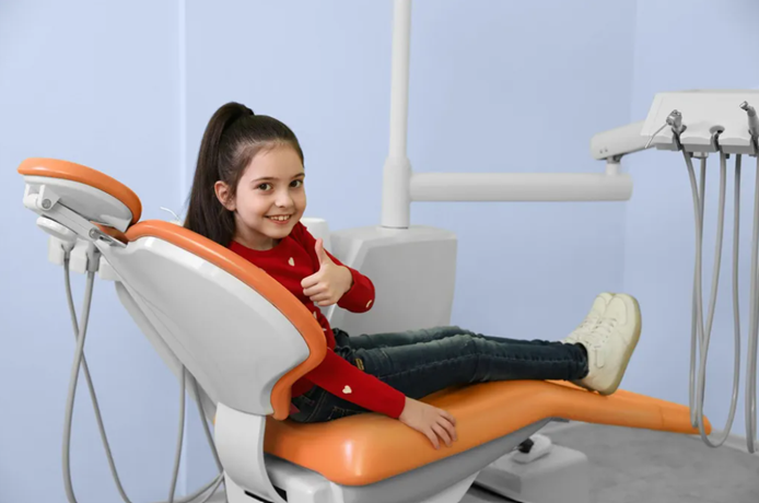 Smiling child in the orthodontic chair at Brieden Orthodontics
